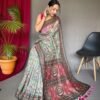Malai cotton saree with Kalamkari inspired print, bold border and contrast tasselled pallu