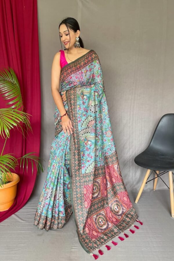 Sky blue malai cotton saree with Kalamkari inspired print, bold border and contrast tasselled pallu