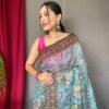 Close-up view of sky blue malai cotton saree with Kalamkari inspired print and detailed border