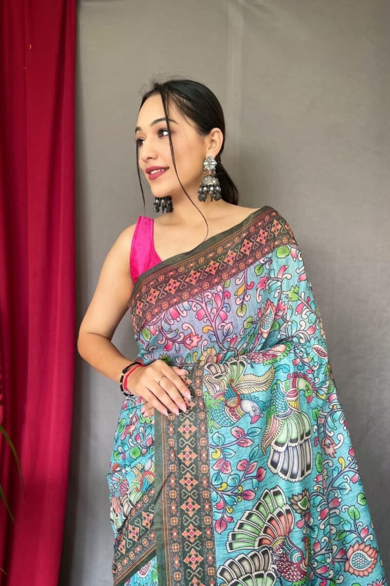 Close-up view of sky blue malai cotton saree with Kalamkari inspired print and detailed border