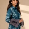 Side view of women’s teal blue printed shirt with geometric patterns and stylish bell sleeves with intricate border detailing.