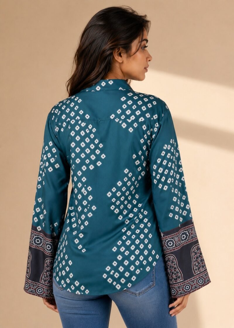 Back view of women’s teal blue printed bell sleeve shirt with white geometric pattern and decorative sleeve border detailing.