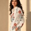 Side profile view of a women's off-white floral printed linen blend shirt featuring intricate red and sage green botanical motifs, collared neckline, and full sleeves.