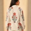 Back view of a women's off-white floral printed linen blend shirt featuring intricate red and sage green botanical motifs, full sleeves, and a relaxed silhouette.