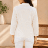 Back view of women's white floral print shirt with collared neckline and three-quarter sleeves DS025