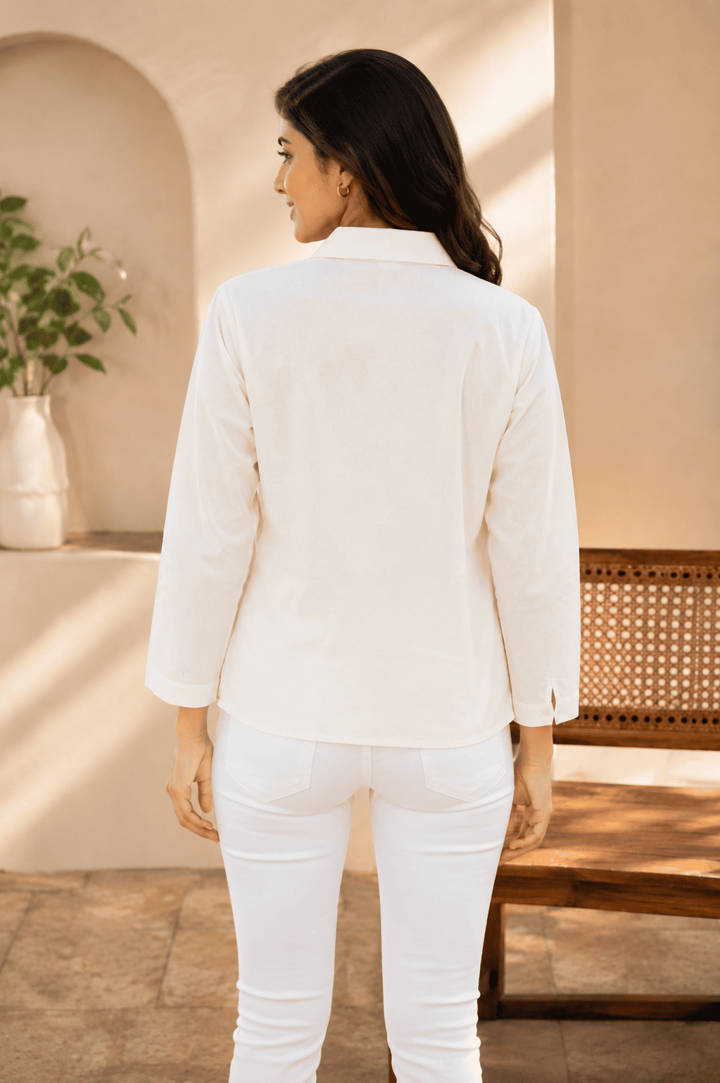 Back view of women's white floral print shirt with collared neckline and three-quarter sleeves DS025