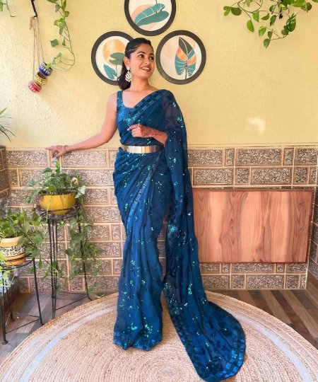 A model wearing a stunning blue ready-to-wear designer Indian saree, showcasing elegance and style