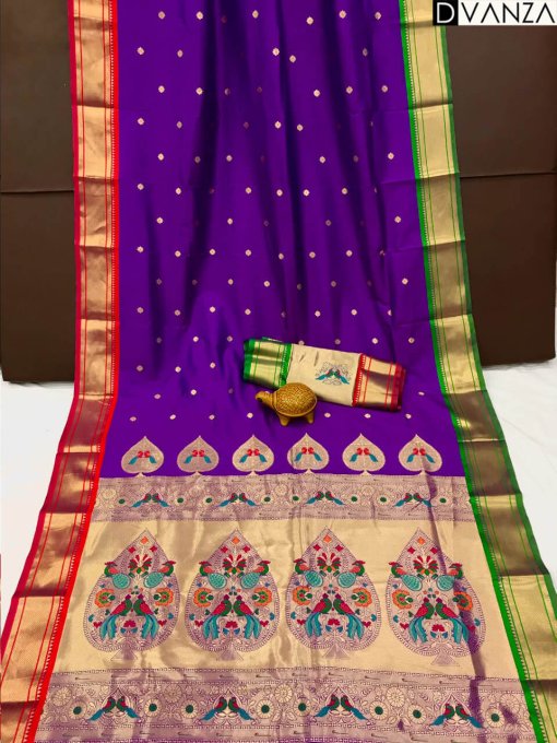 A purple Kanchipuram Paithani silk saree with a peacock design.