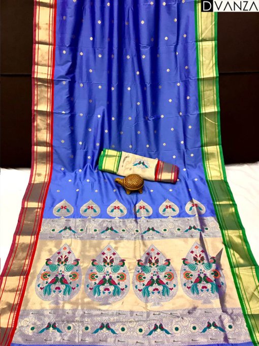 A royal blue Kanchipuram Paithani silk saree with a peacock design.