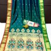 A sea green Kanchipuram Paithani silk saree with a peacock design.