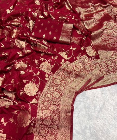 Close-up of the ornate woven border on a maroon pure georgette silk saree.