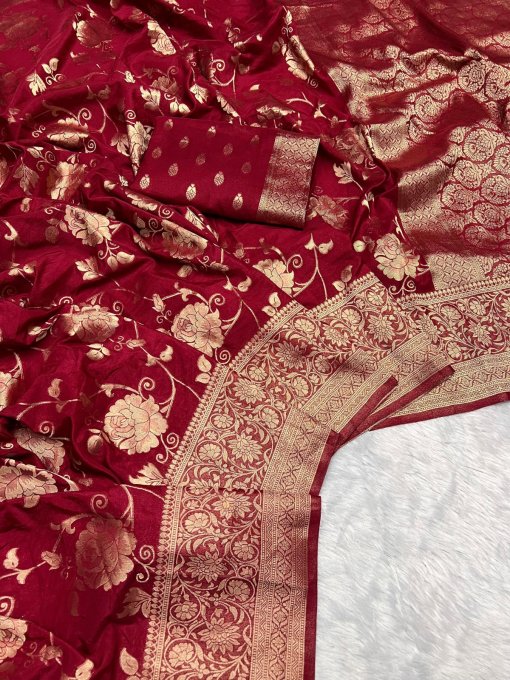 Close-up of the ornate woven border on a maroon pure georgette silk saree.